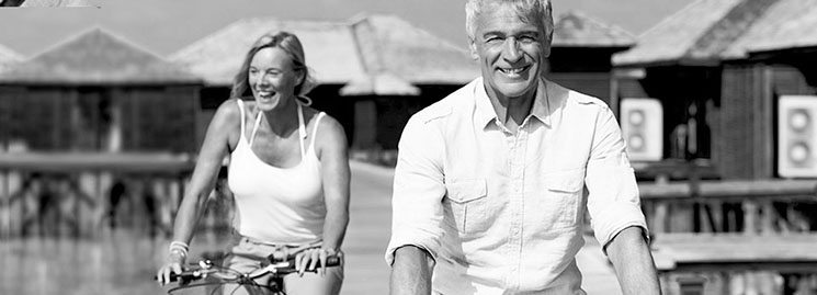 Hearing Aid Fitting - Couple riding a bicycle